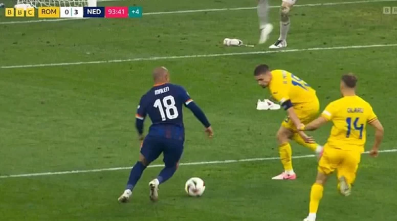 Weird! Romanian fans throw shoes into the penalty area to obstruct their opponents and prevent further goals