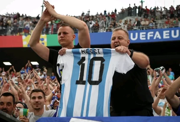 Distraction tactic? Slovenian fans hold up Messi jersey to C Ronaldo