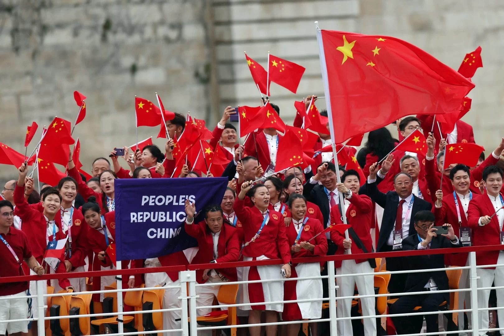 Here They Come! China's Delegation Makes Grand Entrance by Boat with Ma Long Waving the National Flag